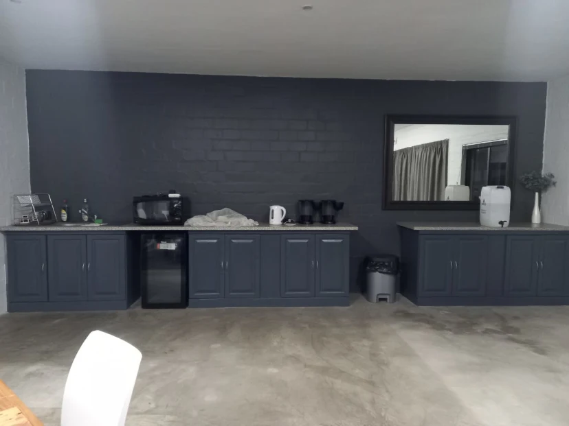Complete church kitchen view with refinished gray cabinets